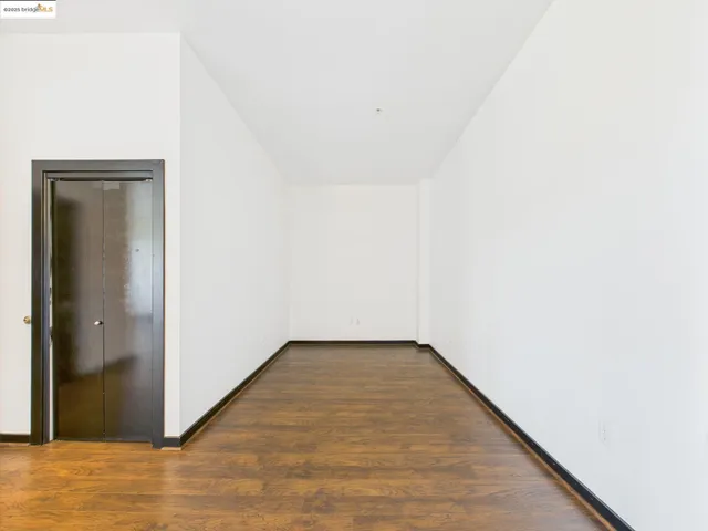 a view of a small space with wooden floor