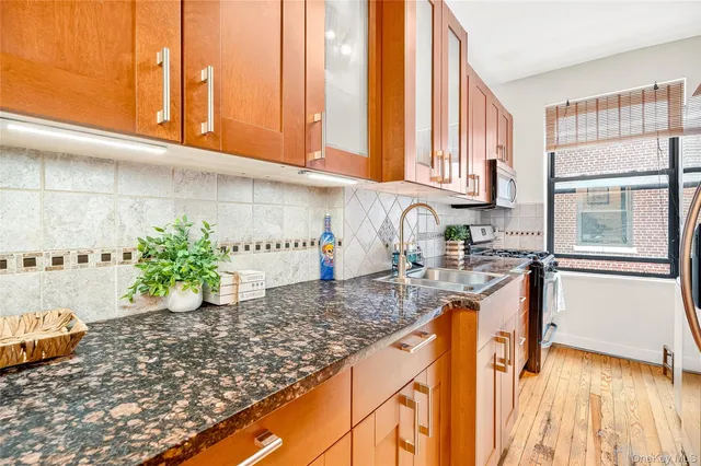 a kitchen with sink and window