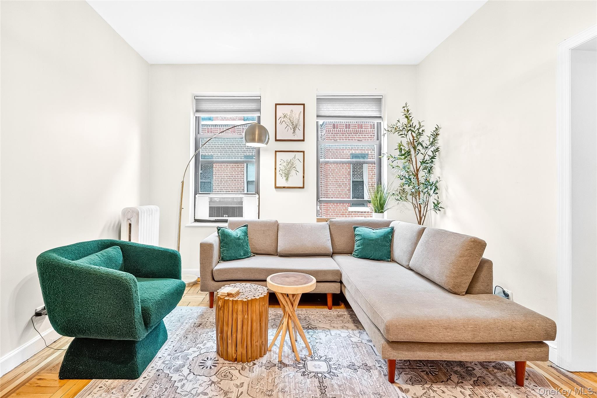 1976 Lafontaine Avenue, Unit 4D Bronx, NY 10457 - Photo 21 of 32 a living room with furniture and a large window
