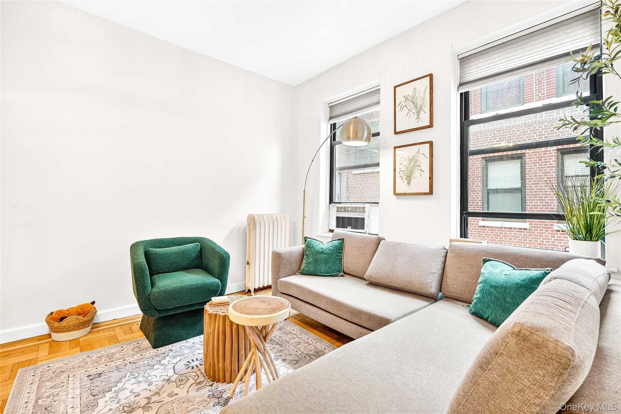 1976 Lafontaine Avenue, Unit 4D Bronx, NY 10457 - Photo 23 of 32 a living room with furniture and a window
