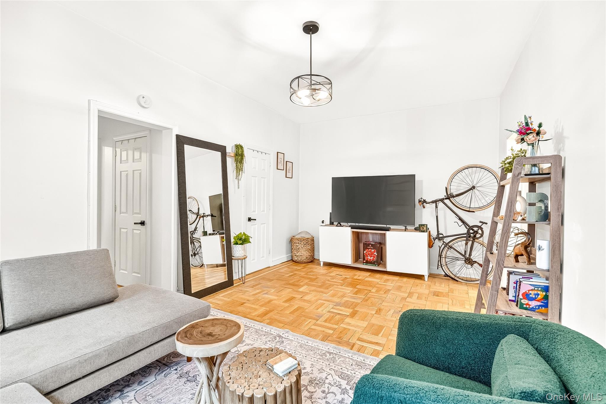 1976 Lafontaine Avenue, Unit 4D Bronx, NY 10457 - Photo 24 of 32 a living room with furniture and a flat screen tv
