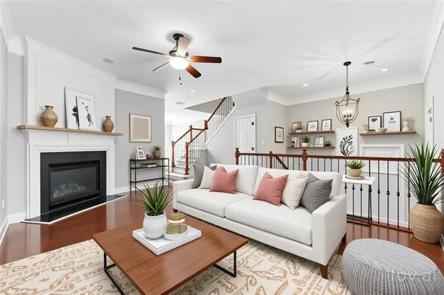 a living room with furniture fireplace and a table
