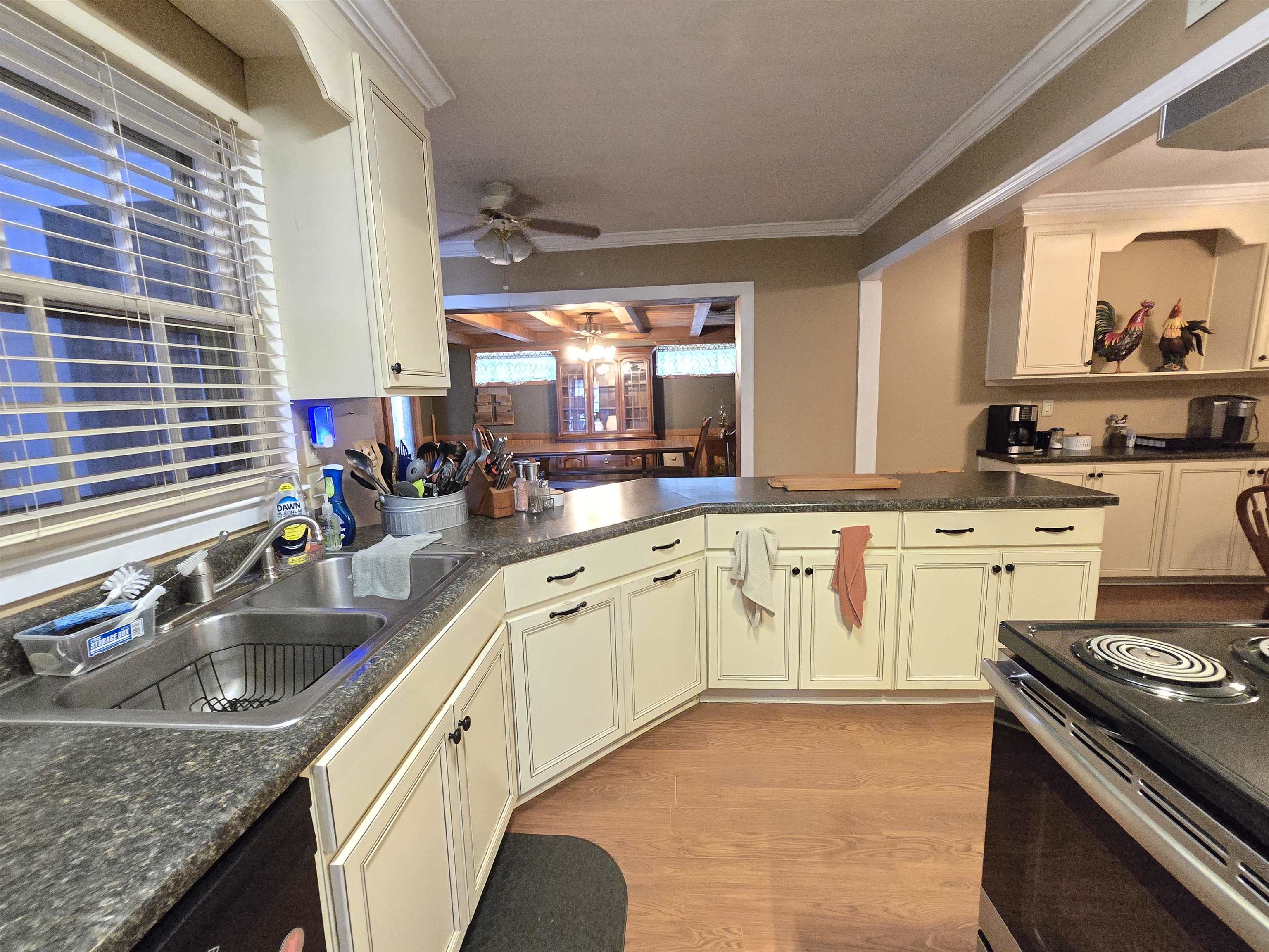 4885 Macon Road Memphis, TN 38122 - Photo 21 of 39 a kitchen with granite countertop a sink stove and cabinets