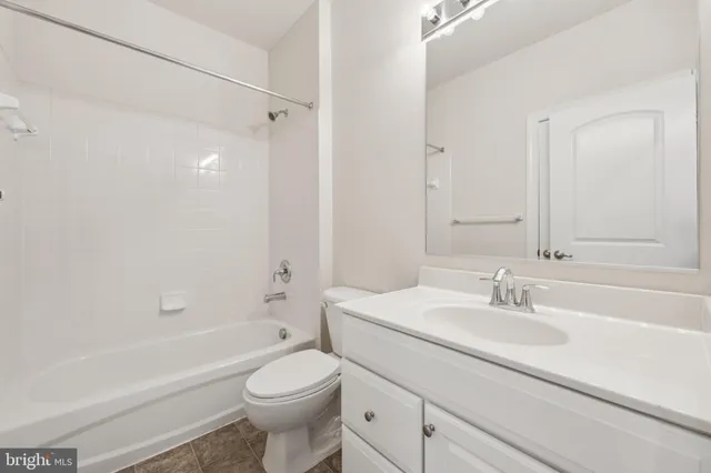 a bathroom with a sink a toilet and a bathtub