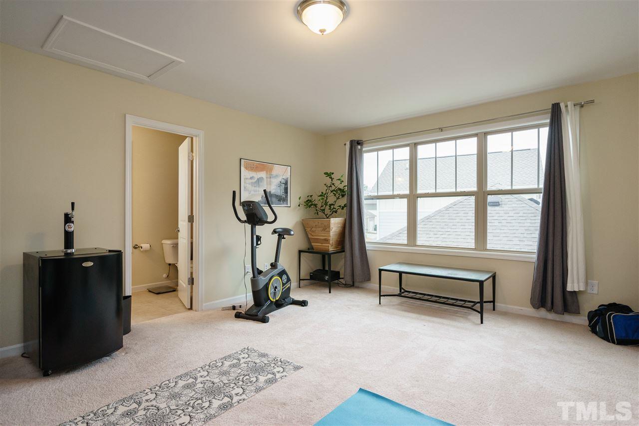 1561 Fullerton Place Raleigh, NC 27607 - Photo 22 of 25 a view of a room with gym equipment