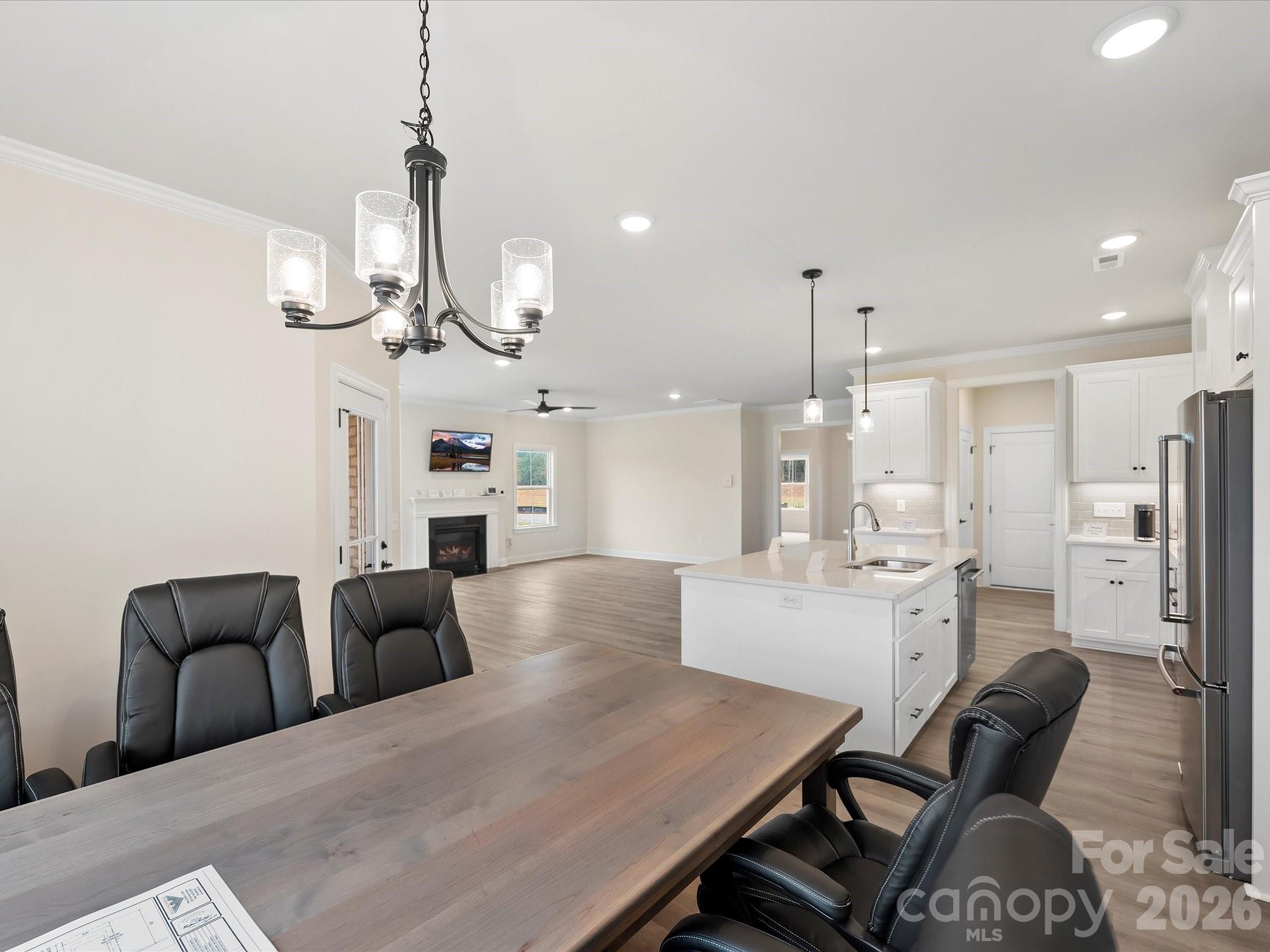 1296 Archer Loop Monroe, NC 28110 - Photo 13 of 39 a very nice looking kitchen with a table and chairs