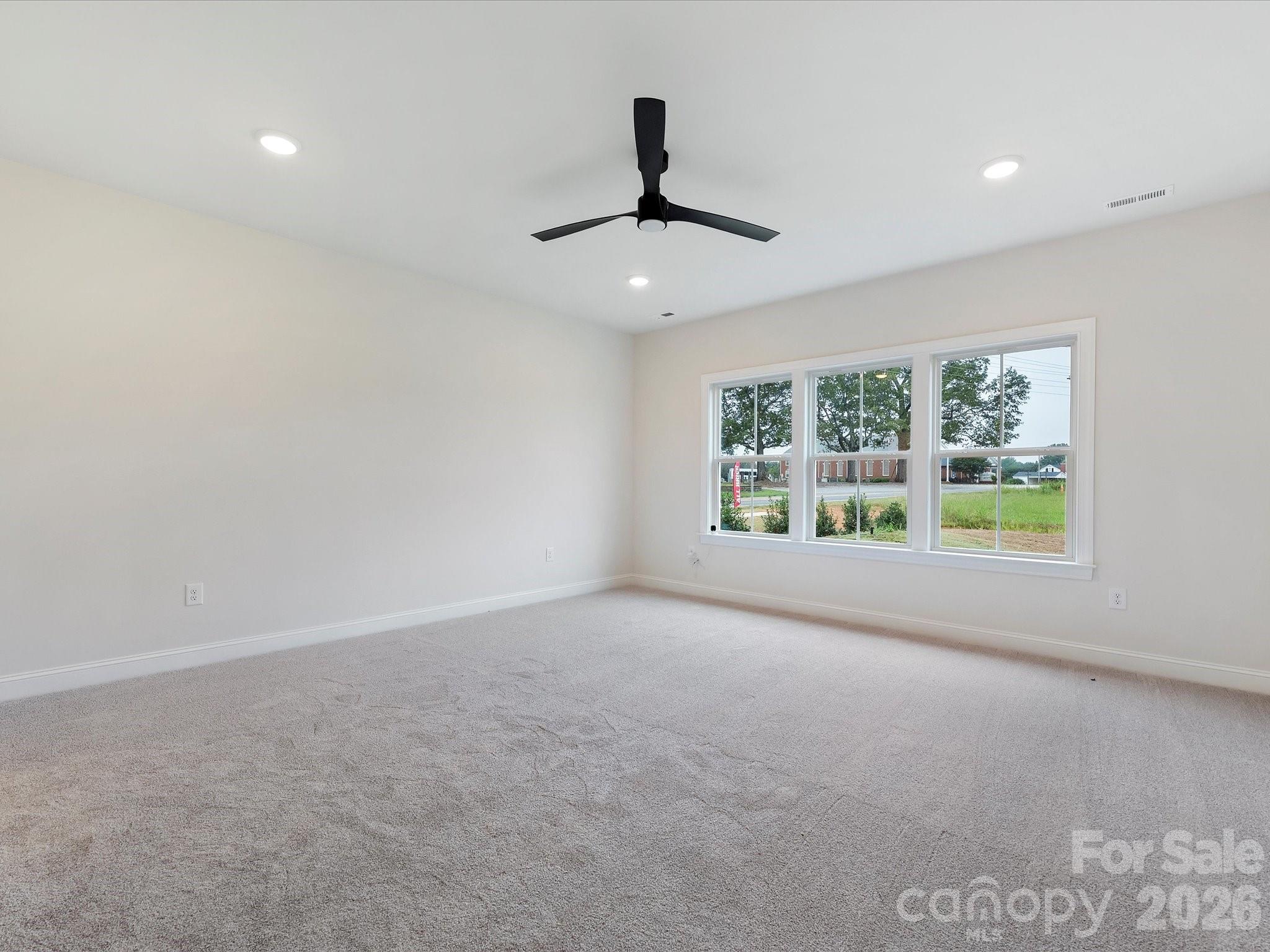 1296 Archer Loop Monroe, NC 28110 - Photo 16 of 39 a view of an empty room with a window