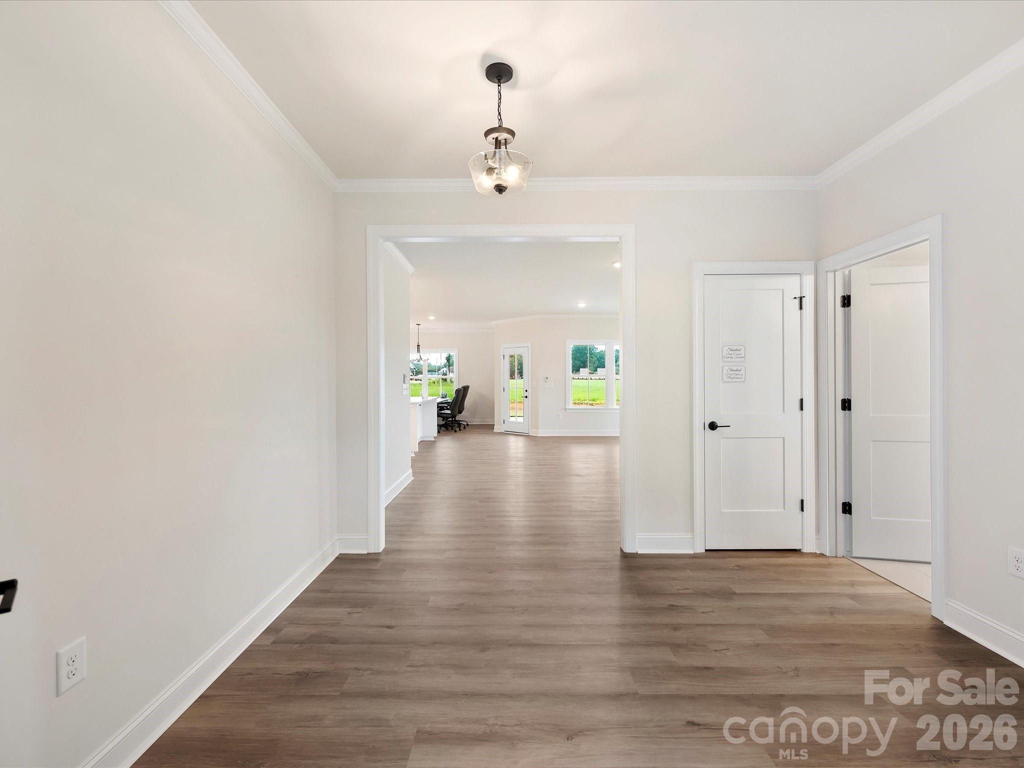 1296 Archer Loop Monroe, NC 28110 - Photo 2 of 39 a view of a hallway with wooden floor
