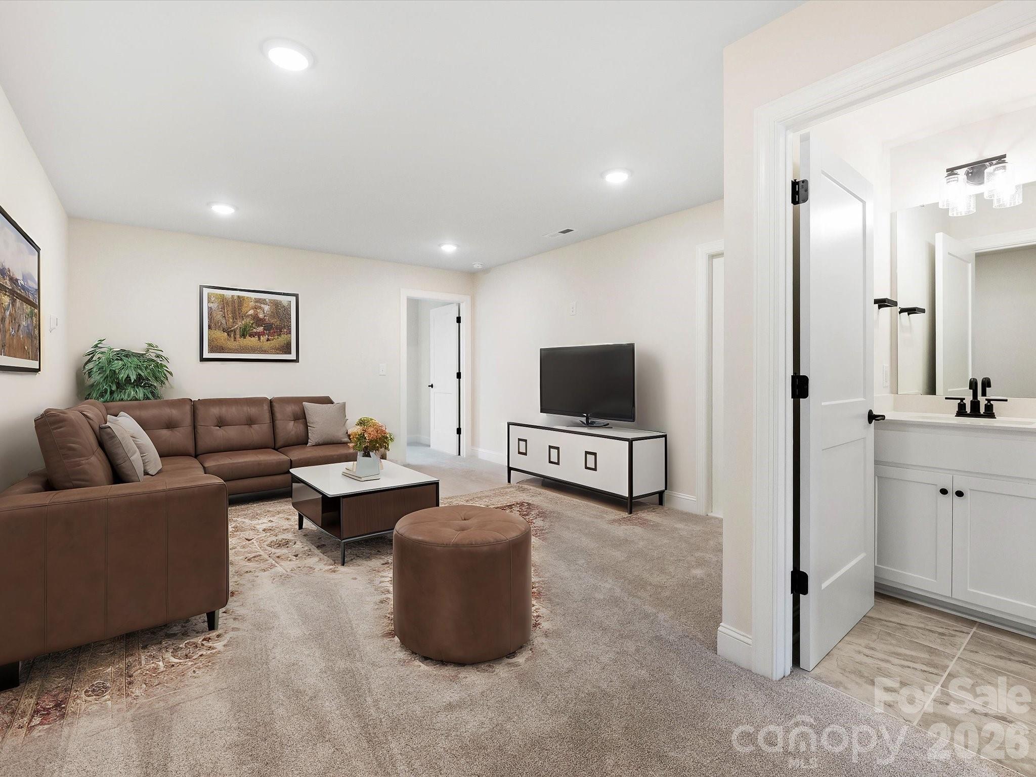 1296 Archer Loop Monroe, NC 28110 - Photo 26 of 39 a living room with furniture and a flat screen tv