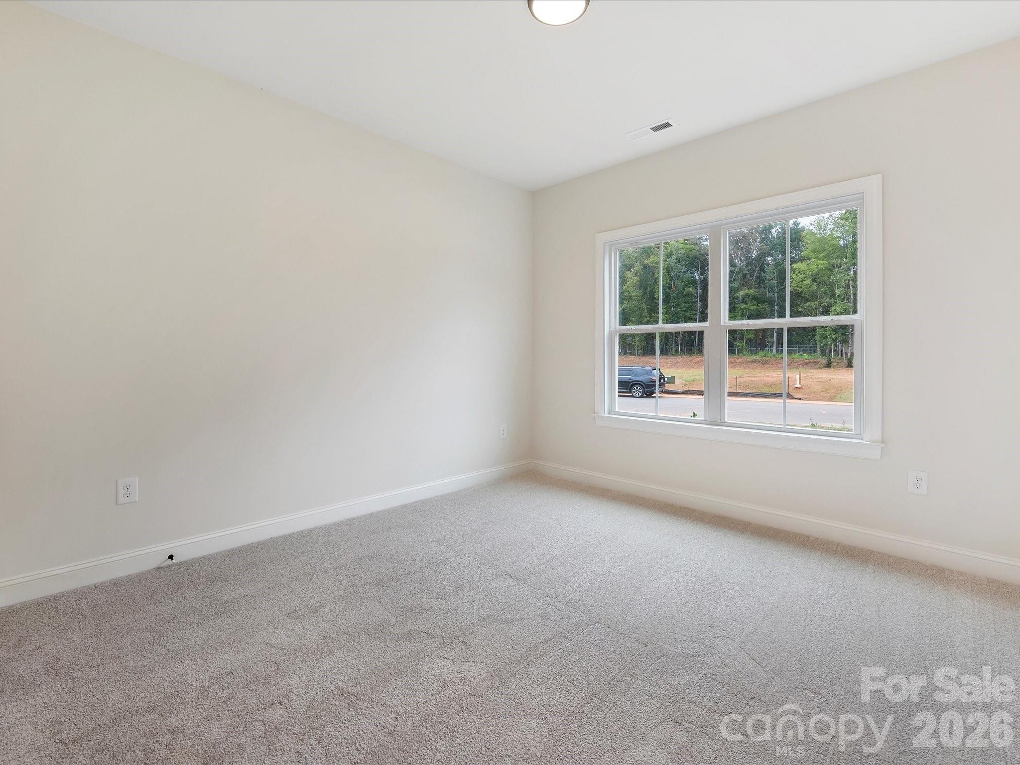 1296 Archer Loop Monroe, NC 28110 - Photo 27 of 39 an empty room with a window