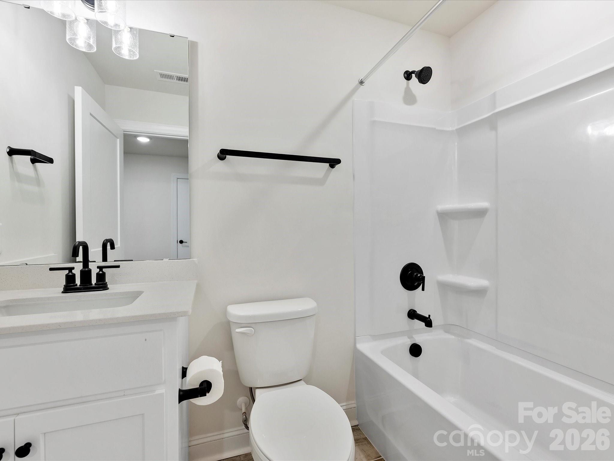 1296 Archer Loop Monroe, NC 28110 - Photo 30 of 39 a bathroom with a bathtub shower sink vanity and toilet