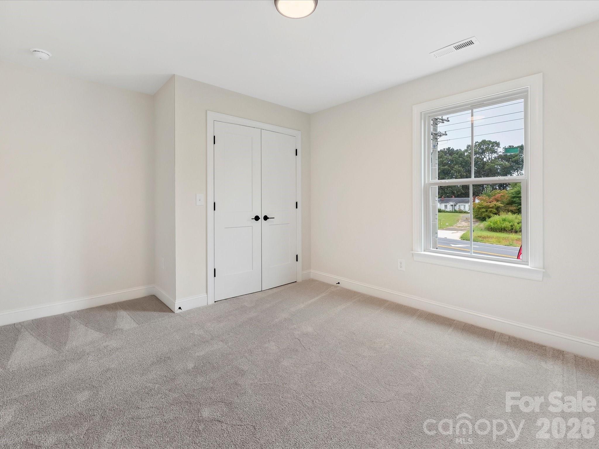 1296 Archer Loop Monroe, NC 28110 - Photo 31 of 39 an empty room with windows