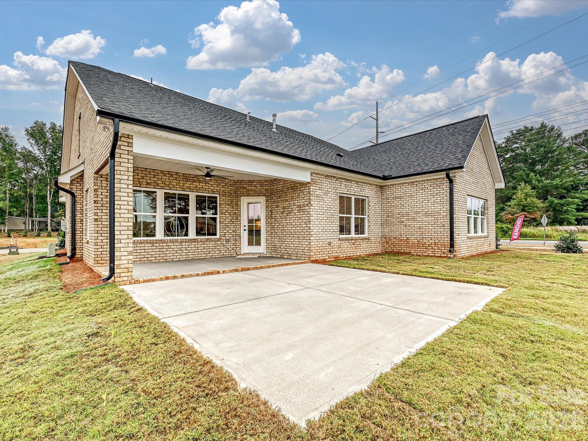 1296 Archer Loop Monroe, NC 28110 - Photo 33 of 39 a front view of a house with a garden
