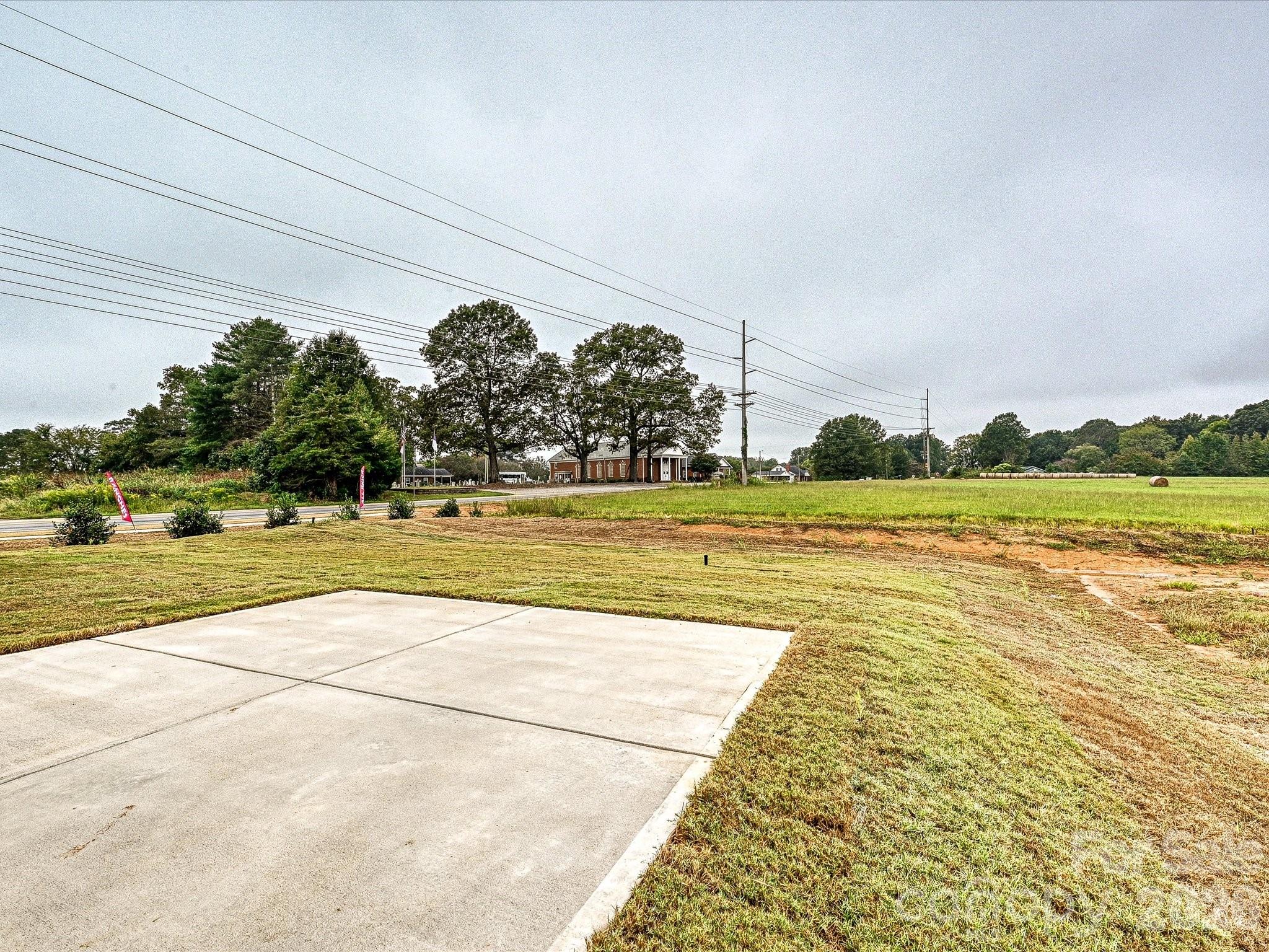 1296 Archer Loop Monroe, NC 28110 - Photo 35 of 39 a view of a swimming pool and a yard