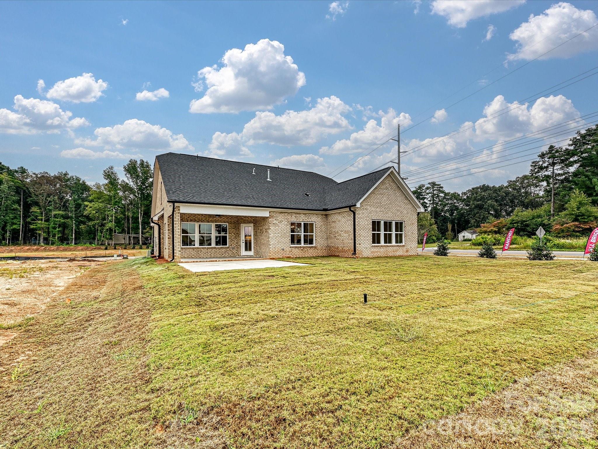 1296 Archer Loop Monroe, NC 28110 - Photo 36 of 39 a front view of house with outdoor space and swimming pool