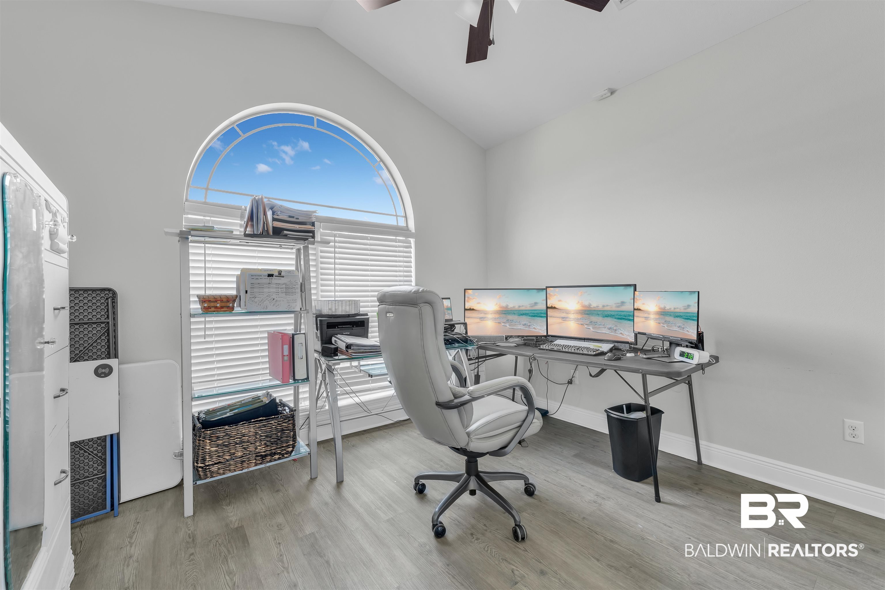 22565 Nana Loop East Silverhill, AL 36576 - Photo 15 of 26 Home office featuring vaulted ceiling, ceiling fan, baseboards, and wood finished floors