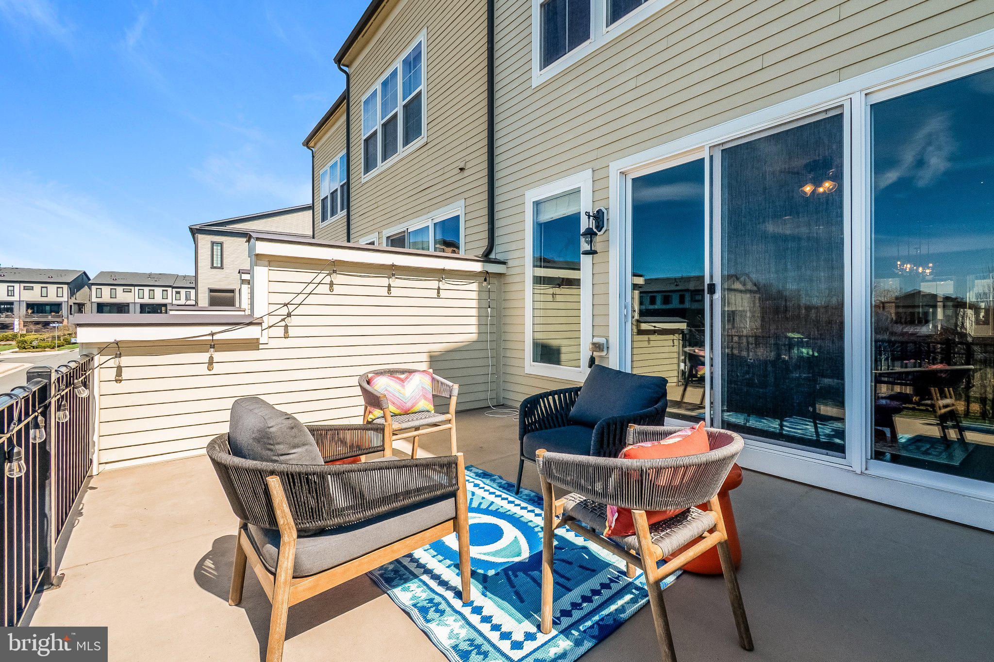 20401 Codman Drive Ashburn, VA 20147 - Photo 8 of 20 Sunny balcony with stylish seating.