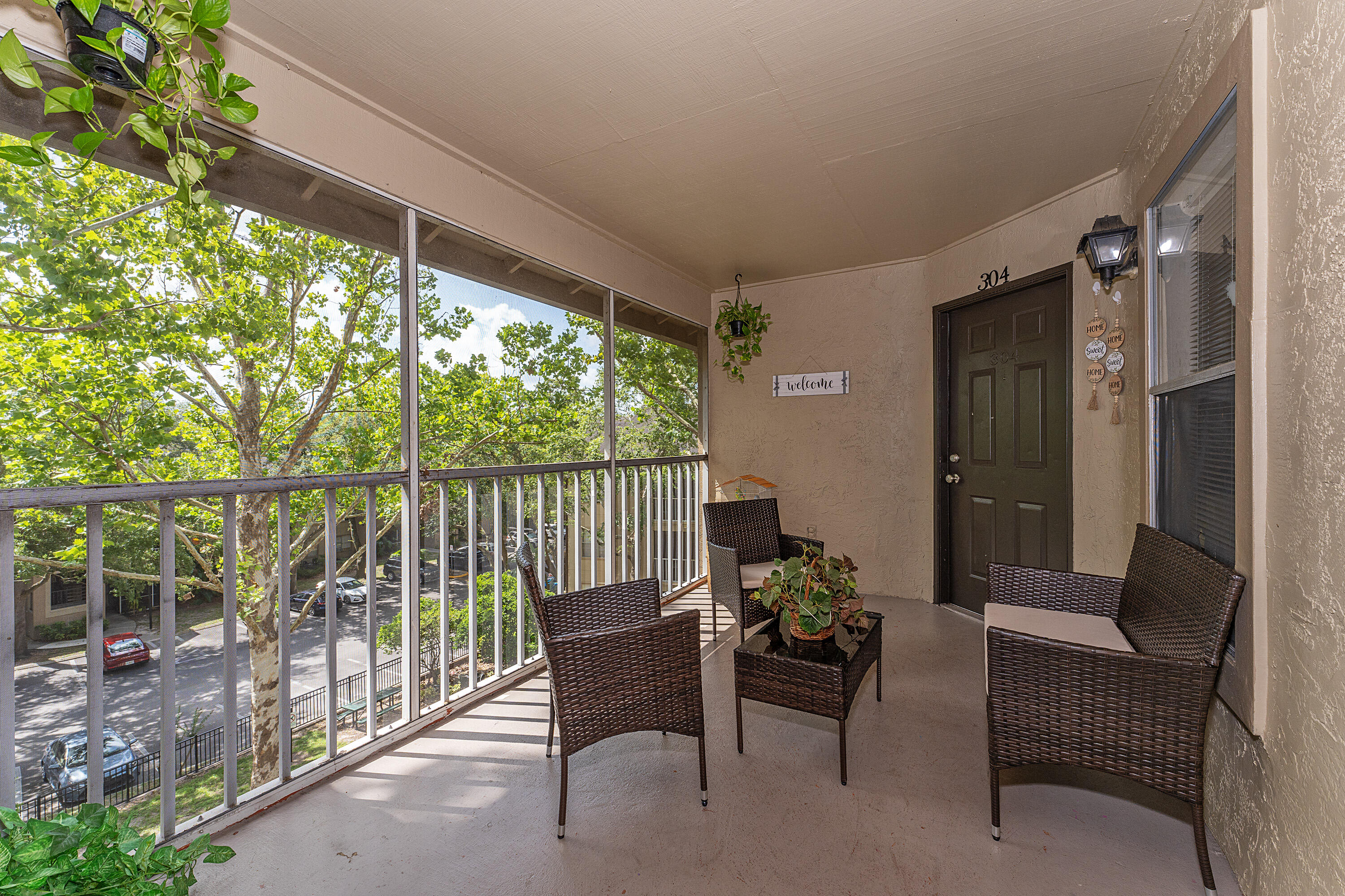 627 Dory Lane, Unit 304 Altamonte Springs, FL 32714 - Photo 22 of 29 a balcony with furniture and a potted plant