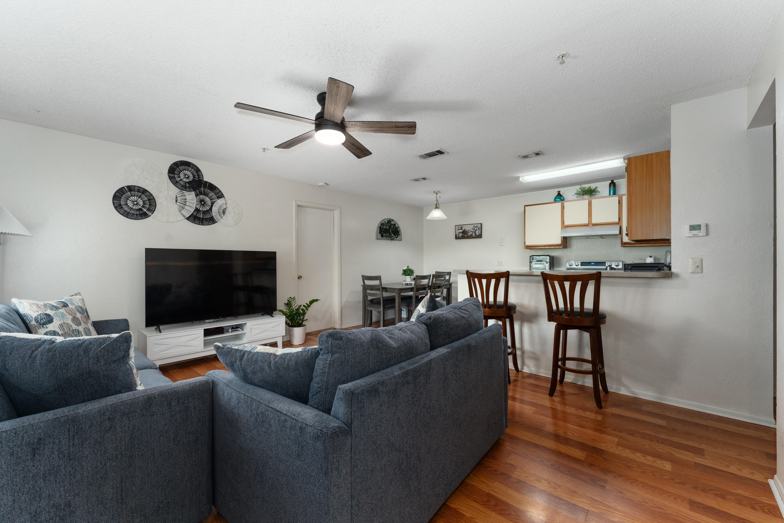 627 Dory Lane, Unit 304 Altamonte Springs, FL 32714 - Photo 4 of 29 a living room with furniture and a flat screen tv