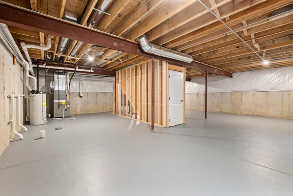 a view of empty room with wooden ceiling