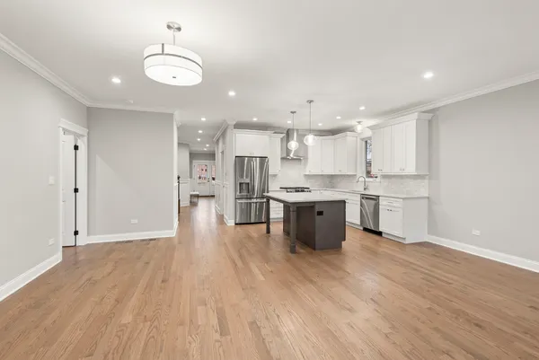 a view of kitchen with wooden floor and window