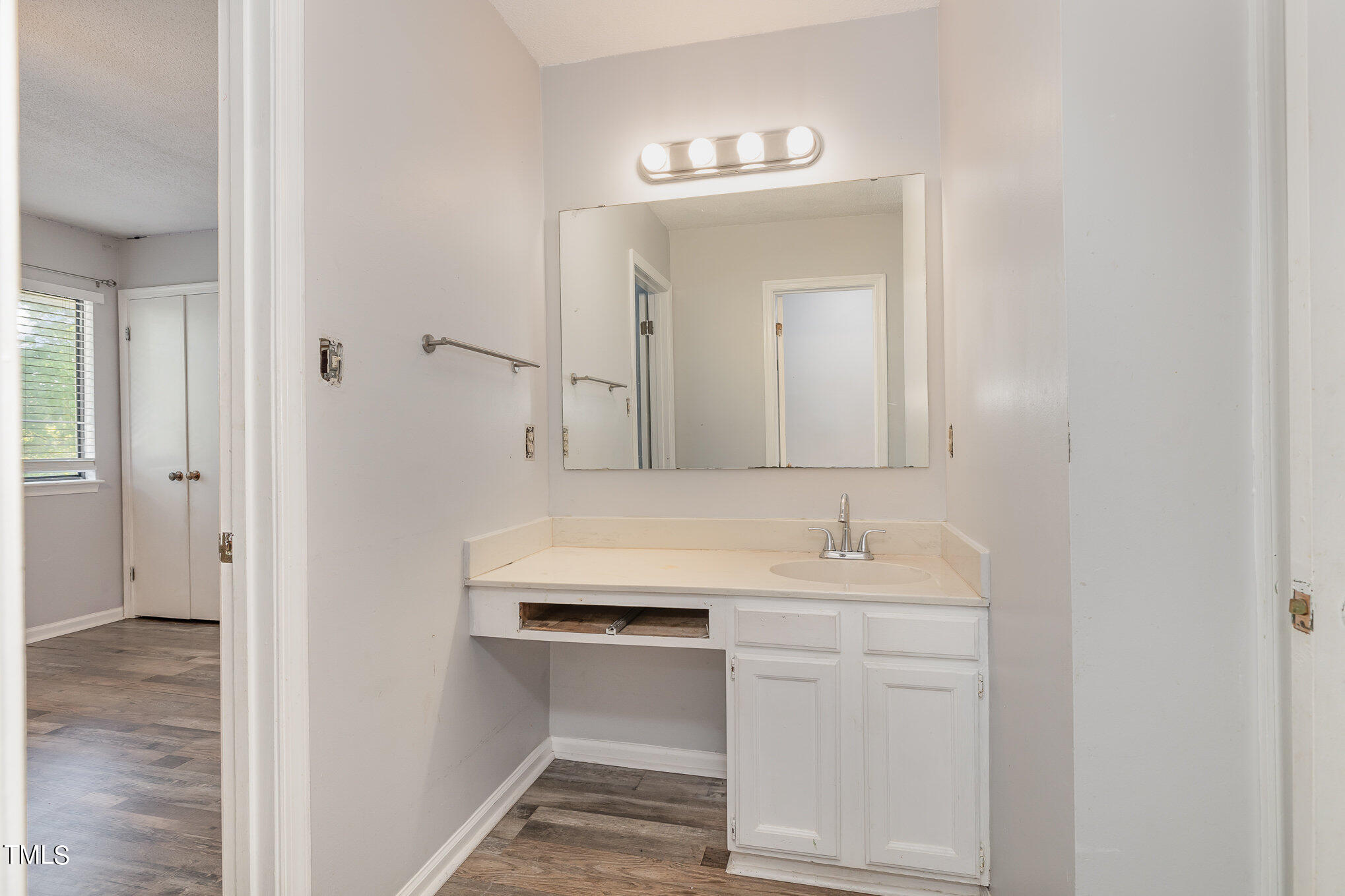 3702 San Pablo Drive Raleigh, NC 27616 - Photo 17 of 26 a bathroom with a sink and a mirror