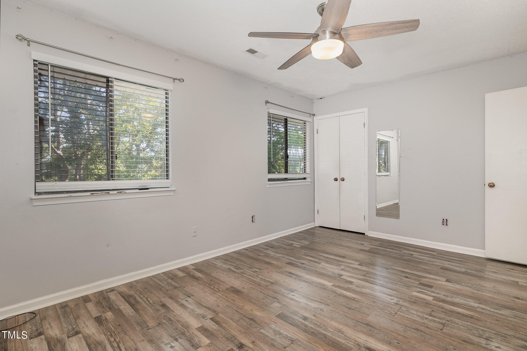 3702 San Pablo Drive Raleigh, NC 27616 - Photo 19 of 26 a view of empty room with wooden floor and fan