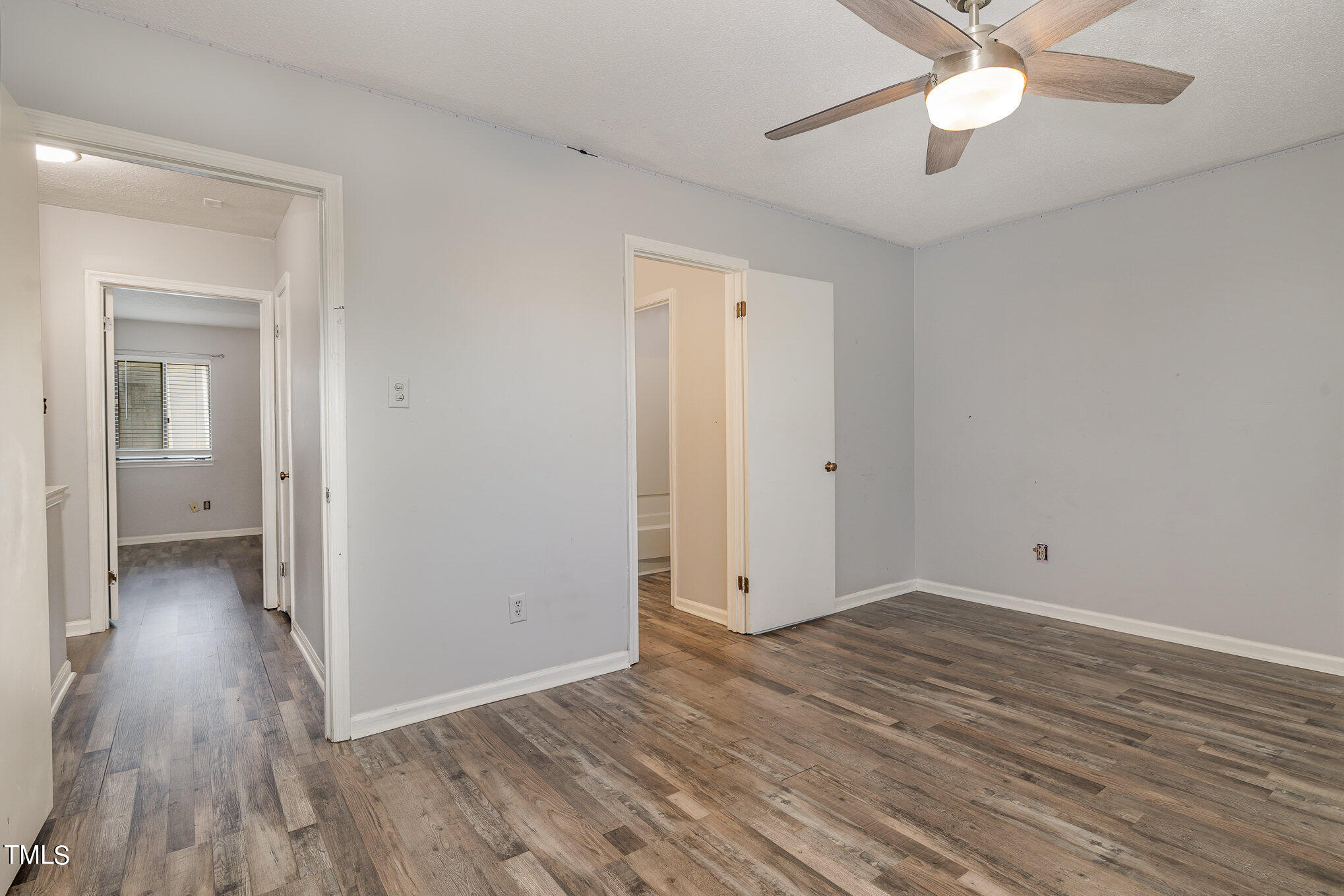 3702 San Pablo Drive Raleigh, NC 27616 - Photo 20 of 26 wooden floor in an empty room with a fan