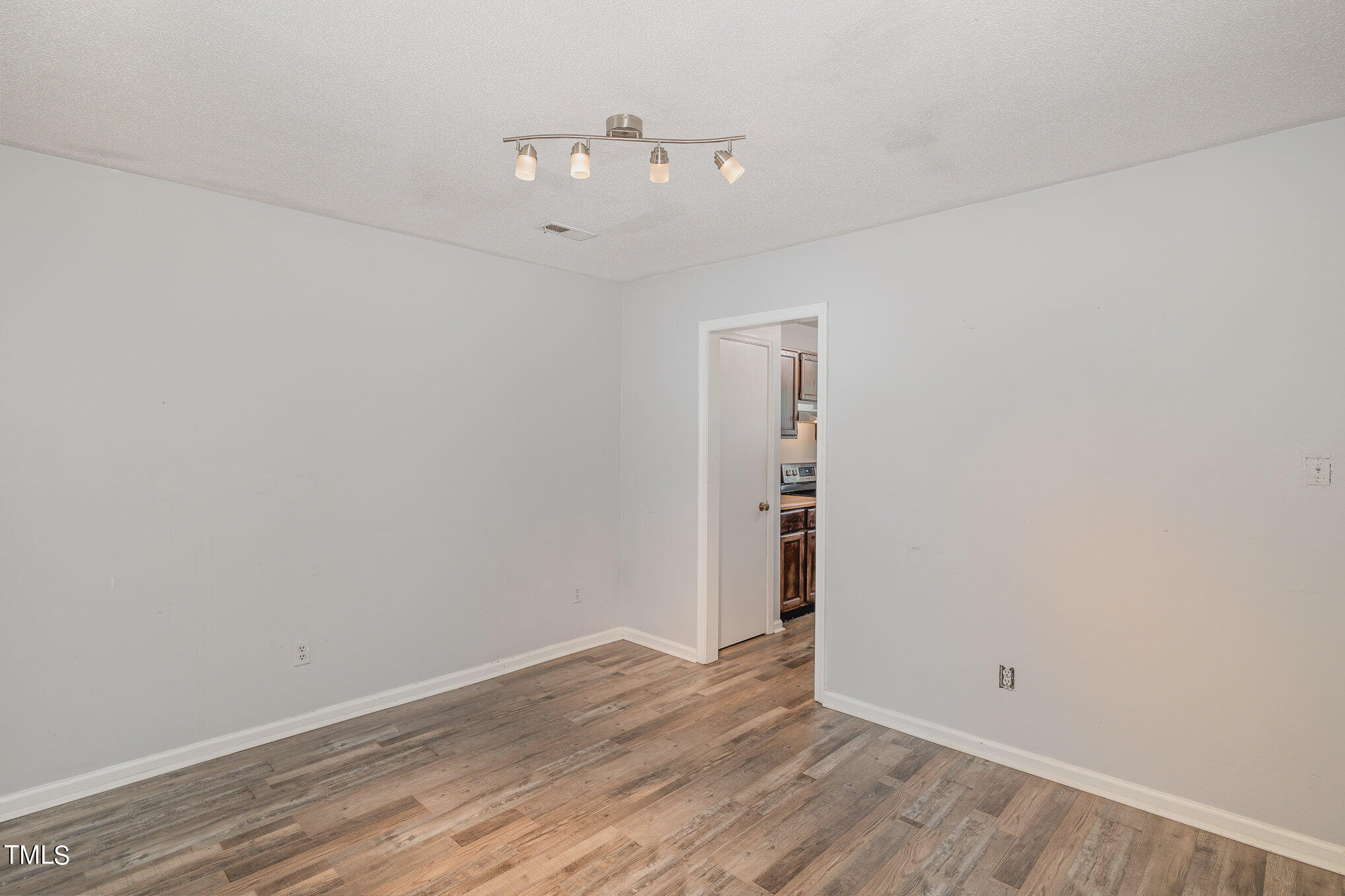 3702 San Pablo Drive Raleigh, NC 27616 - Photo 21 of 26 an empty room with wooden floor