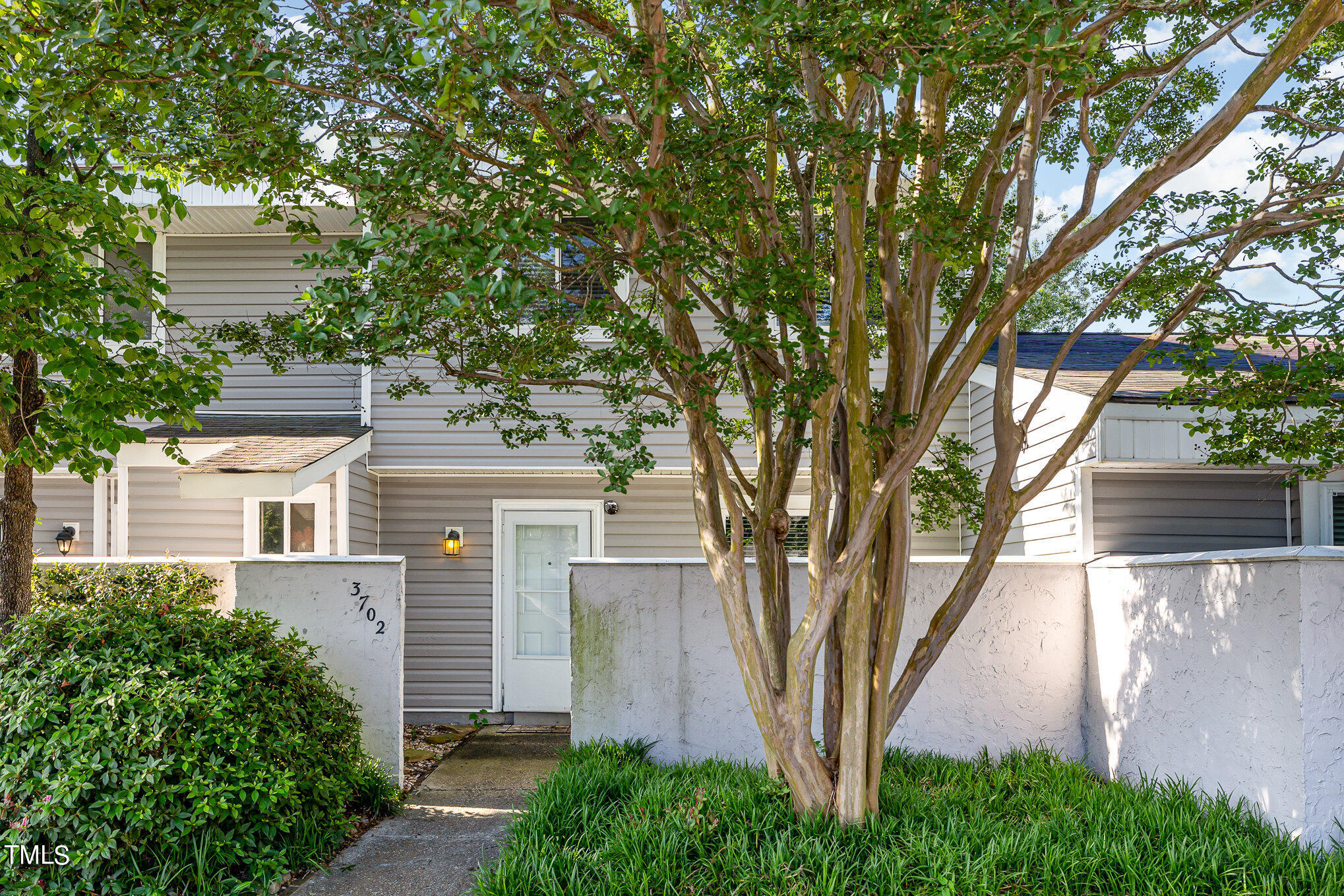 3702 San Pablo Drive Raleigh, NC 27616 - Photo 3 of 26 a front view of a house with a tree