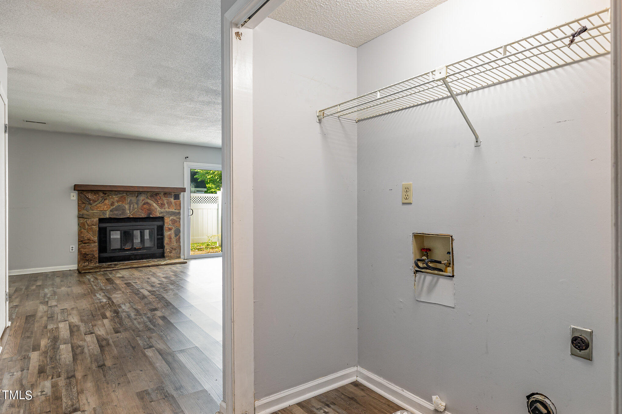 3702 San Pablo Drive Raleigh, NC 27616 - Photo 6 of 26 a view of a storage & utility room with a fireplace