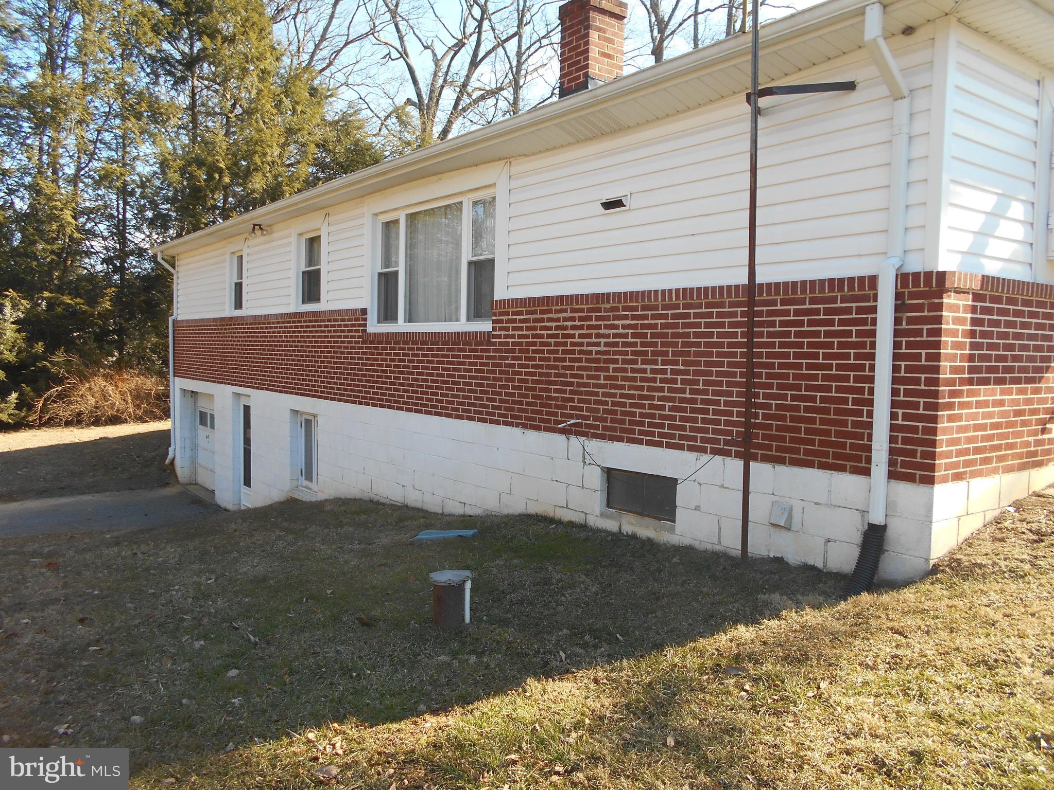 16746 Ridge Road Upperco, MD 21155 - Photo 6 of 22 a view of a house with a yard