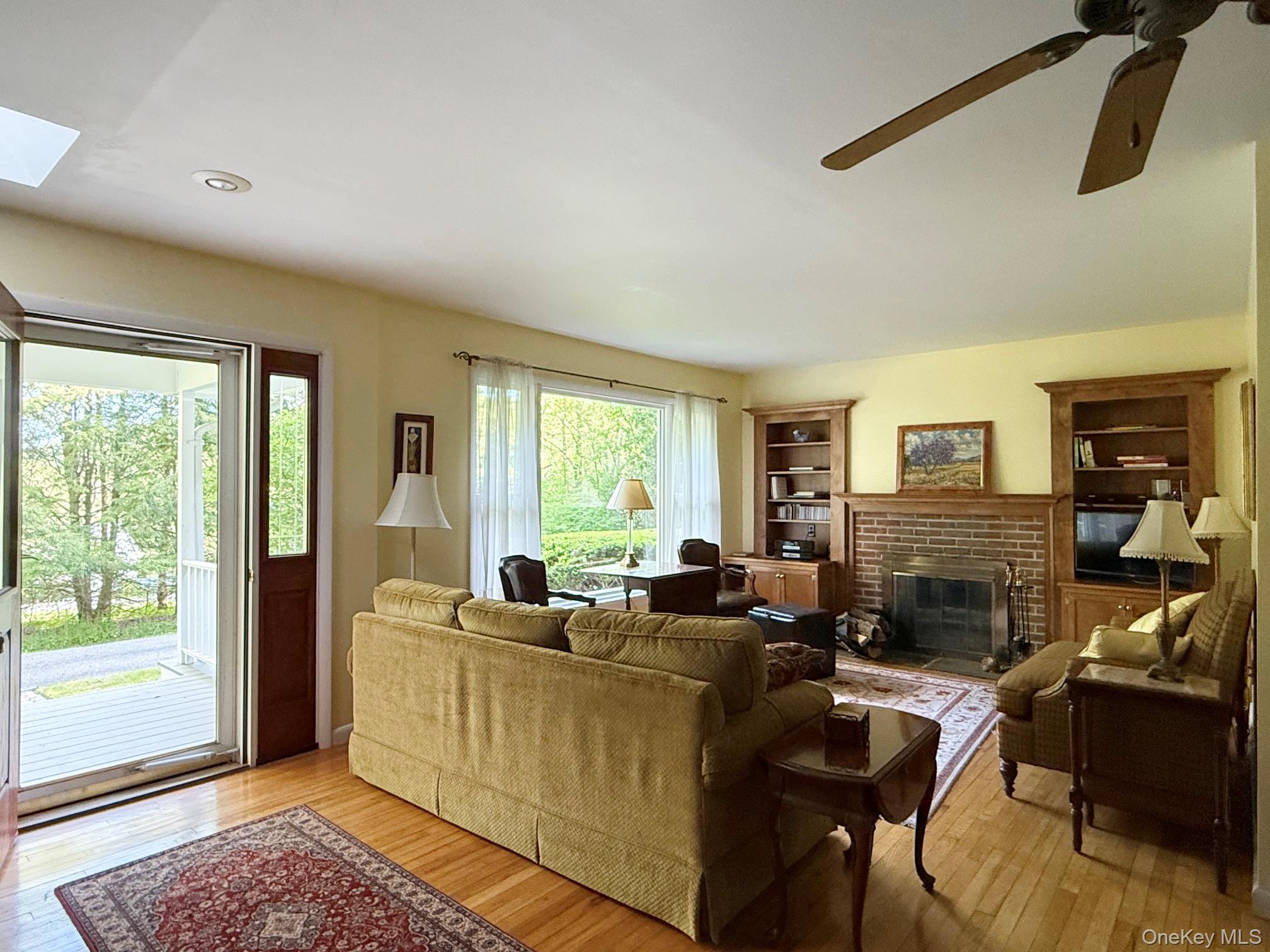 230 Cooper Road Millerton, NY 12546 - Photo 11 of 20 a living room with furniture and a fireplace