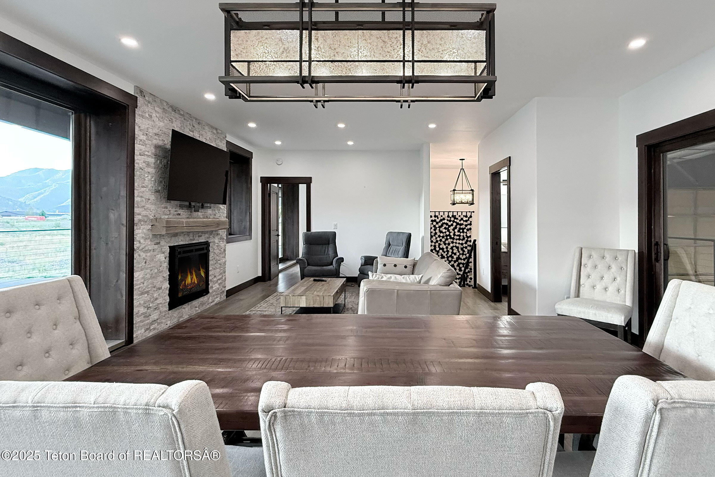 19 Diamandis Drive, Unit 19 Alpine, WY 83128 - Photo 9 of 36 9_aero_hangar_19_upstairs_dining_fire