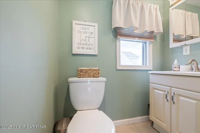 a bathroom with a toilet sink and a window