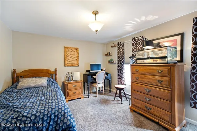 a bedroom with a bed and furniture