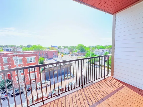 a view of a balcony with wooden floor