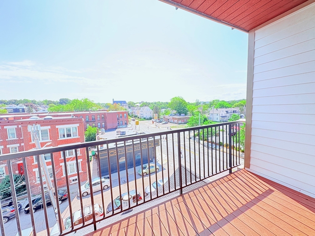 214 Market Street, Unit 405 Boston, MA 02135 - Photo 22 of 22 a view of a balcony with wooden floor