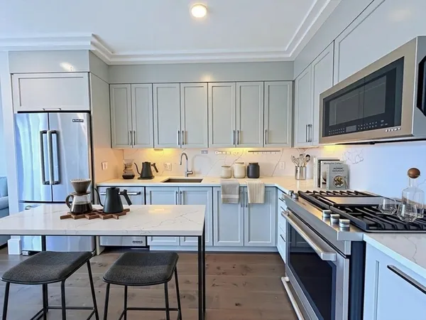 a kitchen with a stove and a microwave