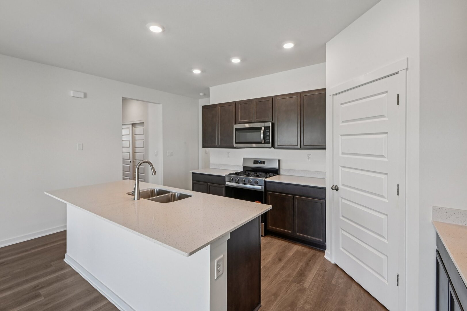809 Mesa Lane Pingree Grove, IL 60140 - Photo 18 of 53 a kitchen with a sink a stove top oven and wooden floor
