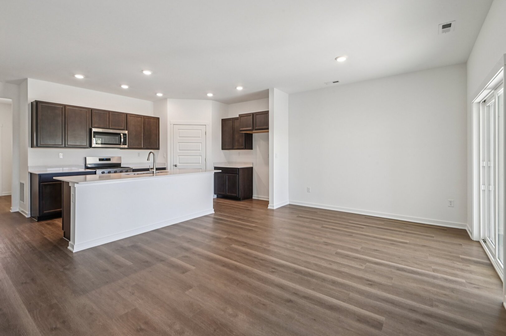 809 Mesa Lane Pingree Grove, IL 60140 - Photo 19 of 53 a view of kitchen with stainless steel appliances granite countertop a stove top oven a sink and a microwave