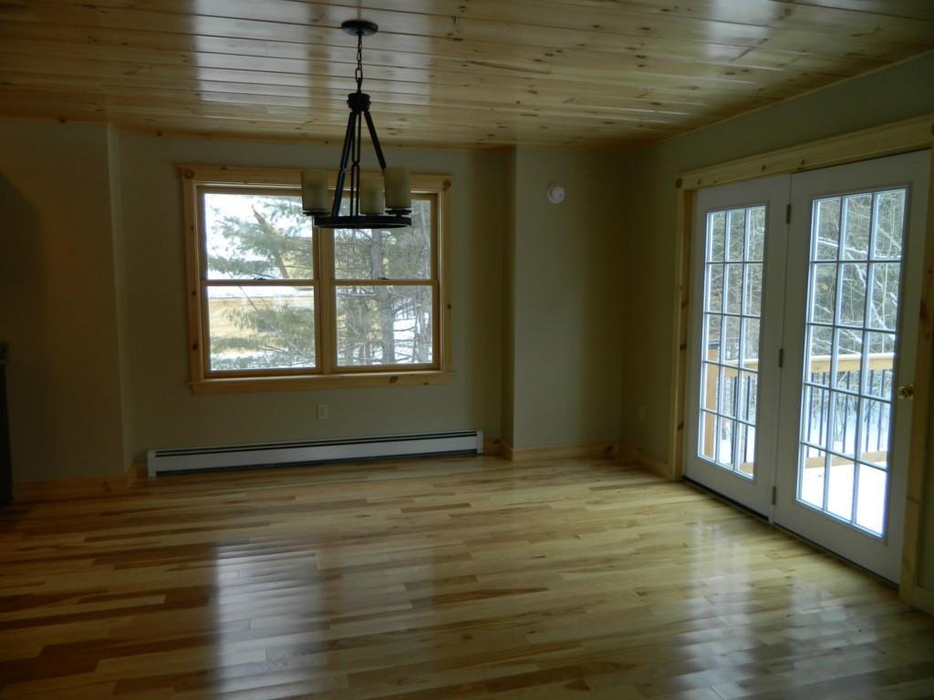 7 Spur Road Bethel, ME 04217 - Photo 7 of 25 Open dining area with a door leading...