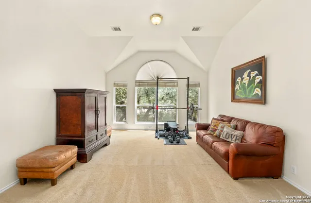 a bedroom with a bed and a couch