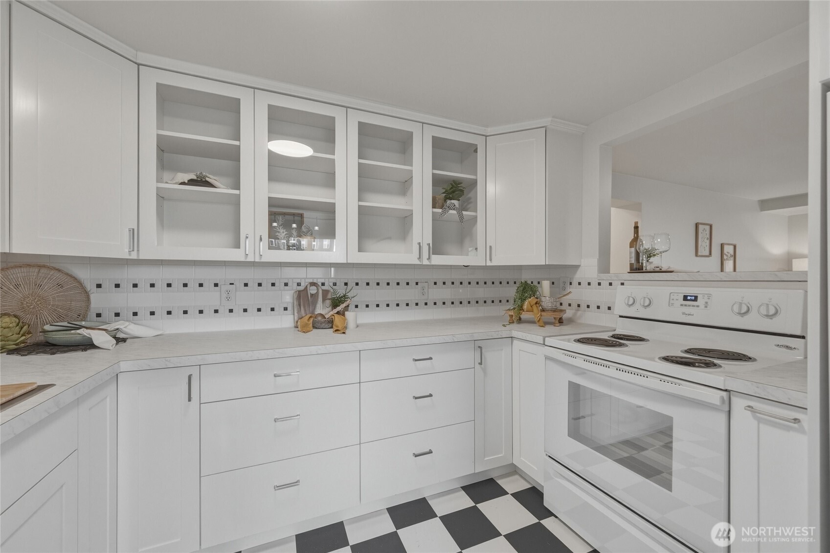 901 North Forest Street, Unit 134 Bellingham, WA 98225 - Photo 13 of 39 a kitchen with granite countertop white cabinets and appliances