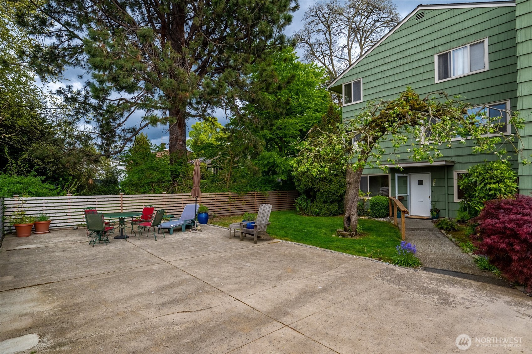 901 North Forest Street, Unit 134 Bellingham, WA 98225 - Photo 2 of 39 a view of a park with couches and table and chairs under an umbrella