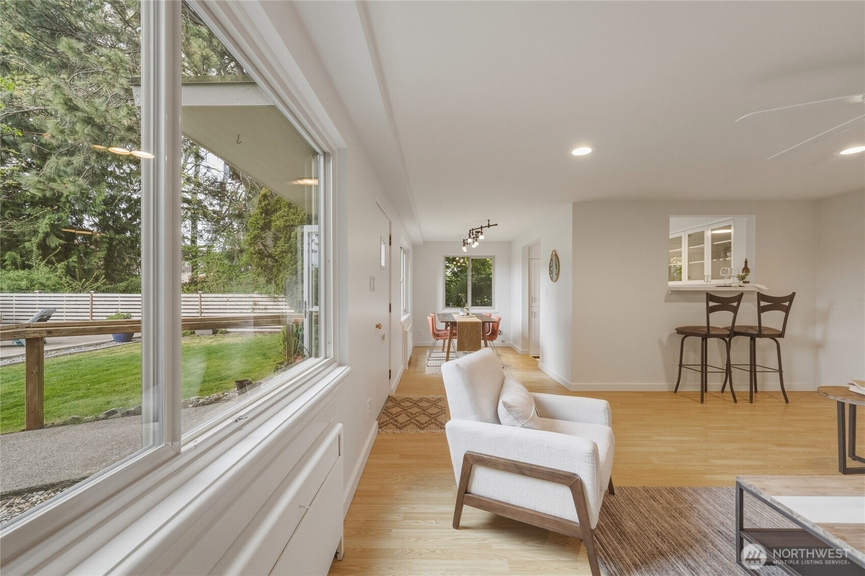 901 North Forest Street, Unit 134 Bellingham, WA 98225 - Photo 25 of 39 a living room with furniture and a floor to ceiling window