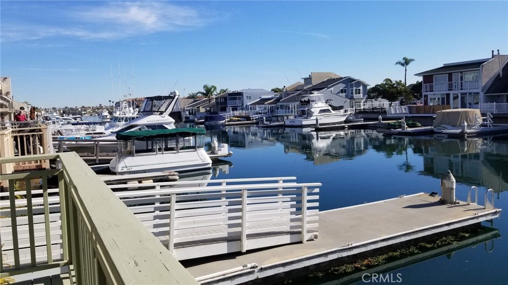 4640 Eastbourne Bay Oxnard, CA 93035 - Photo 15 of 16 a view of a roof deck with table and chairs a barbeque