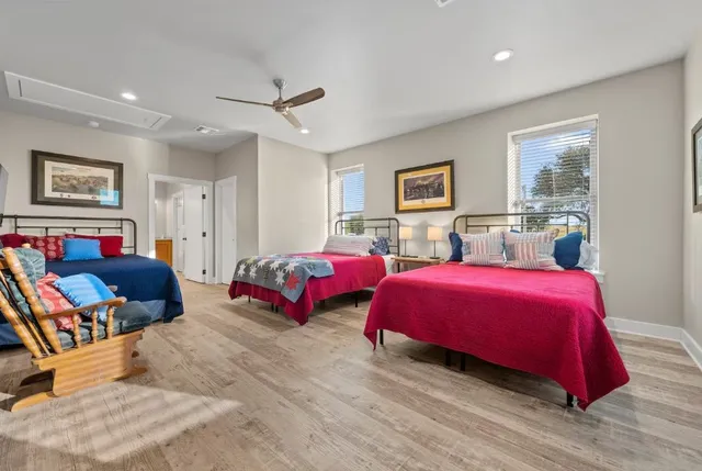 a bedroom with a bed a couch and a dresser