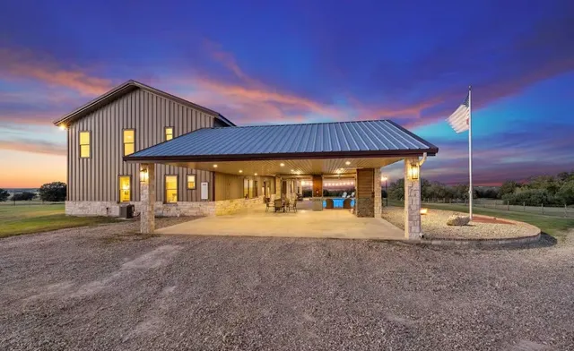 a view of a house with backyard and porch