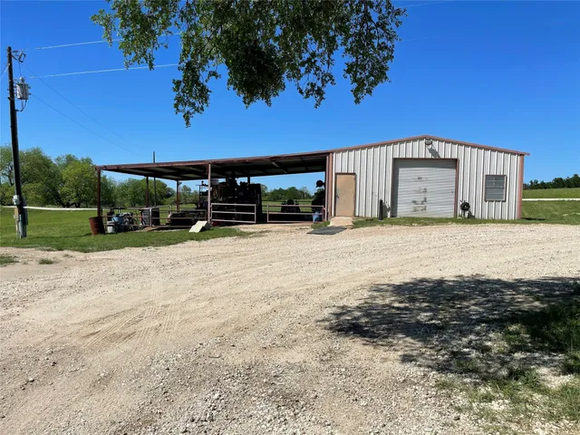a view of street and car parked in front of house